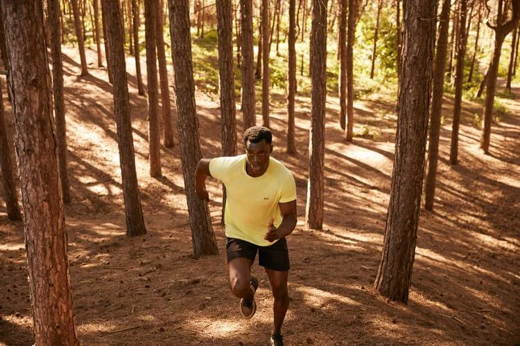 man running in forest